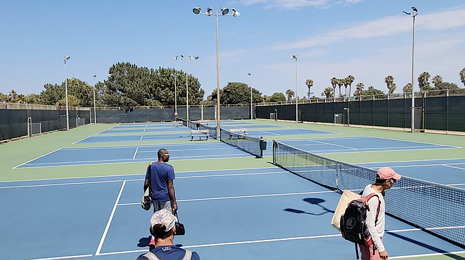 When pickleball boundary lines are placed atop the tennis courts, tennis players can't properly play.
