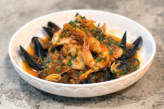 The spaghetti nero Mediterraneo, with squid ink pasta, shrimp, clams, and mussels