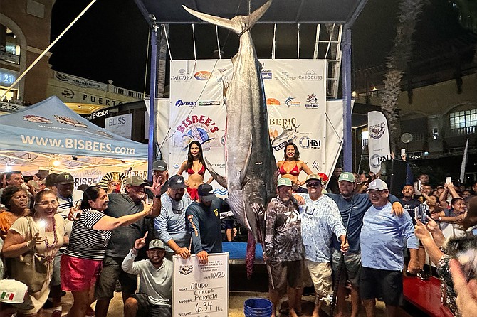 Team Crudo with their winning 634-pound black marlin at the Bisbee’s Black and Blue fishing tournament held in Cabo San Lucas.