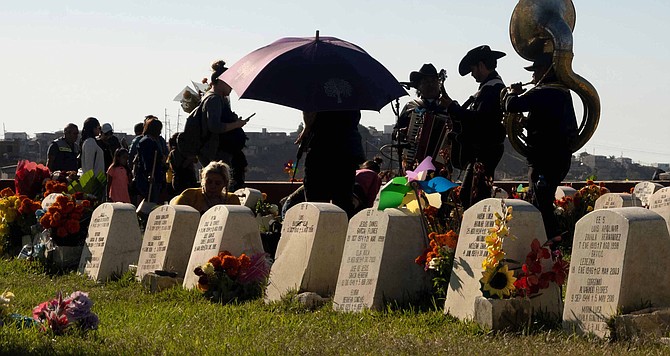 A group of musicians on Dia de los Muertos can earn around $1500. - Image by Luis Guitierrez