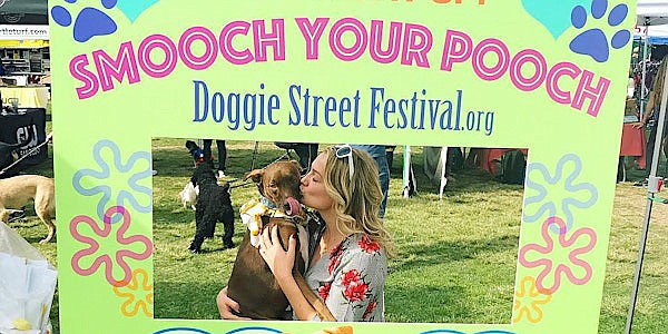 The Doggie Street Festival celebrates dog and cat adoption through vendors, services, music, auctions and food for both doggies and humans.
