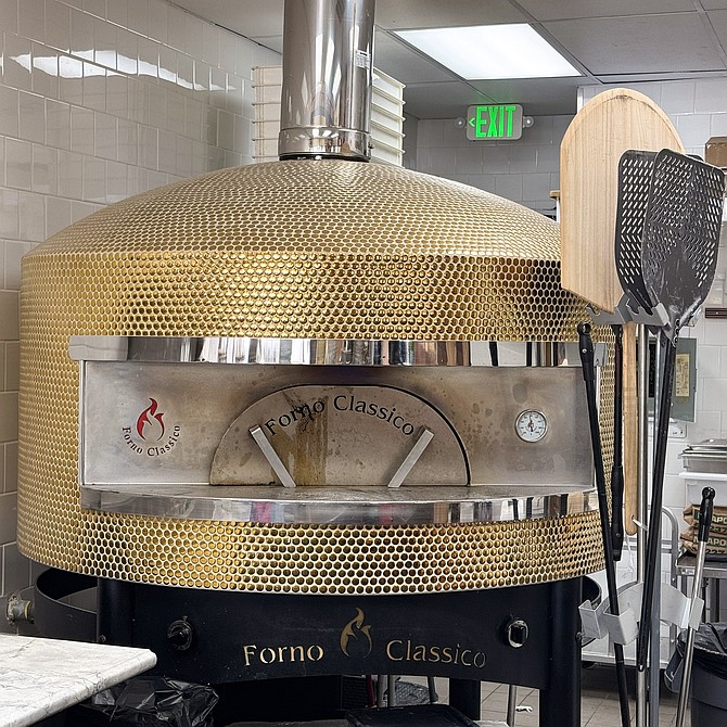 A gas/wood hybrid pizza oven at Pizza by Aromi