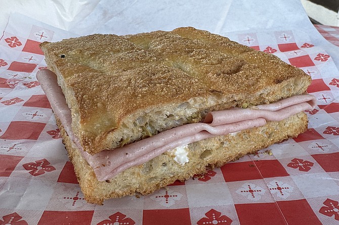 A Tuscan style panini, with mortadella, pistachios, stracciatalla cheese on schiacciata bread