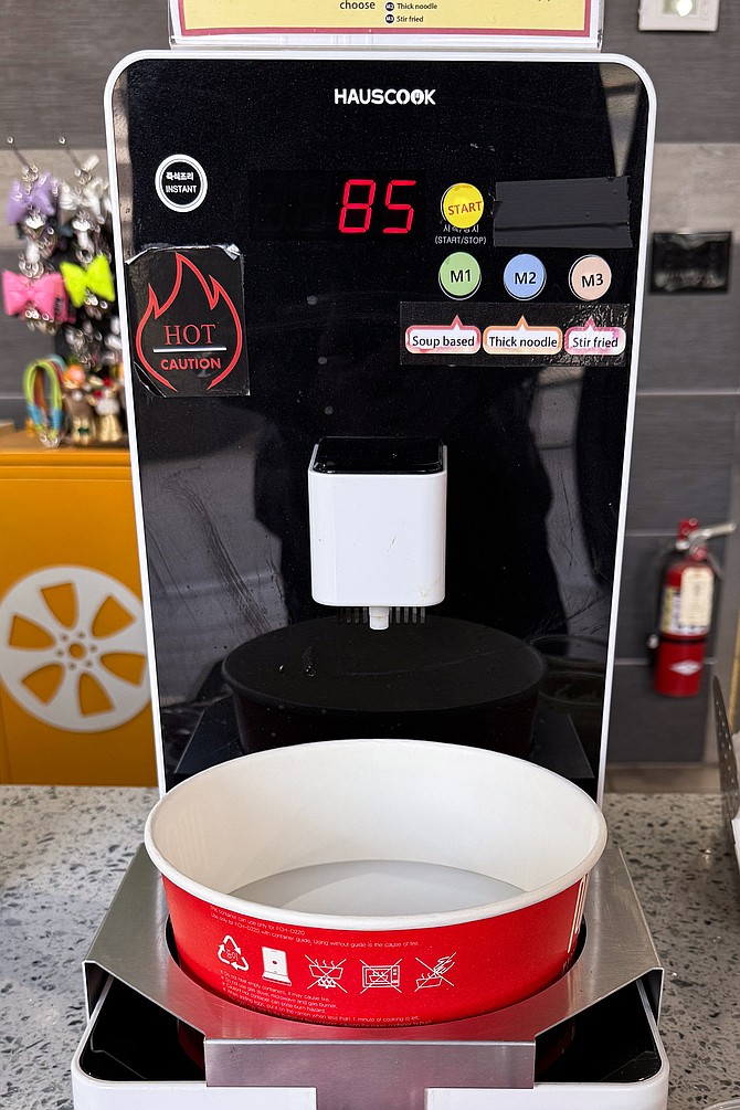 A hot water machine set up specifically to make instant noodles