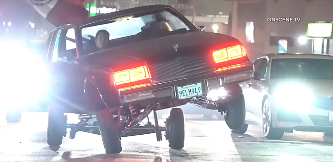 An '80s car on hydraulics bounced along the street. (Socalnewsoutlet)