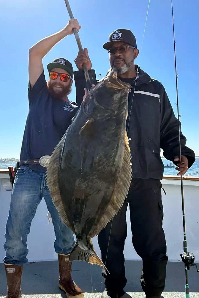 Happy angler with his 34.6-pound halibut caught while fishing aboard the Dolphin during their Wednesday Halibut Derby outing.