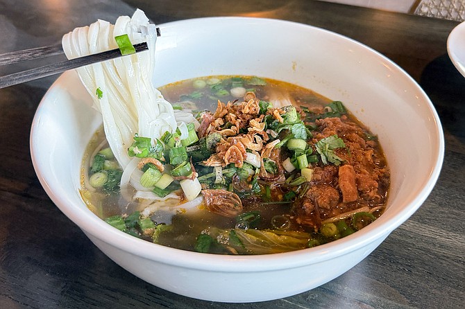 Lao style khao soi: a pork rice noodle soup