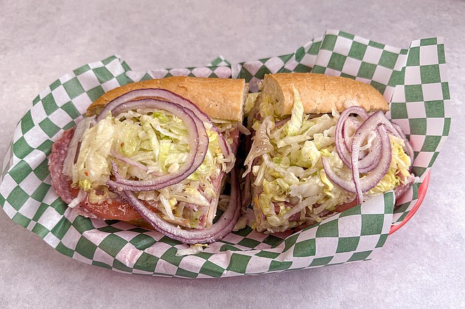 An Italian sub, with salami, ham, and Italian dressing
