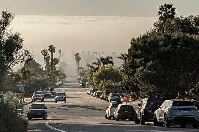 This time of year coastal communities might not see the sun all day and only blocks away sunny skies shine.