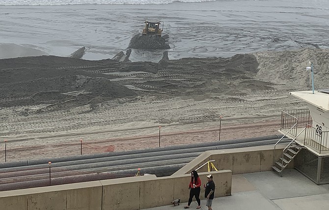 Sand spreading. Next up – Middle Beach south of the Tamarack bridge and then South Beach just north of Terramar