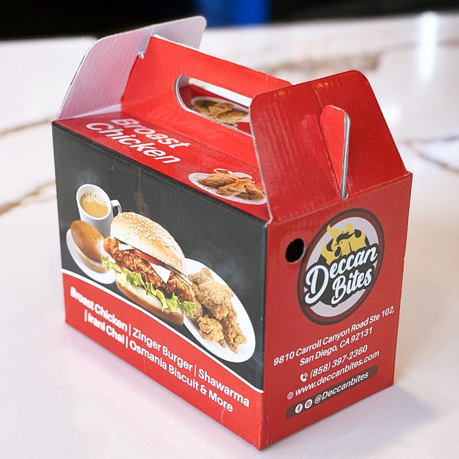 Fried chicken take out served in a box (large buckets also available)