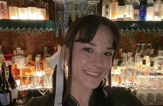 Bartender Dylanna Miller, plus just enough decor in the background to whet your whistle.