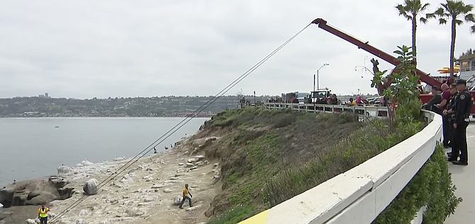 A man died after his car broke through a fence and went over a cliff into the ocean near La Jolla Cove.