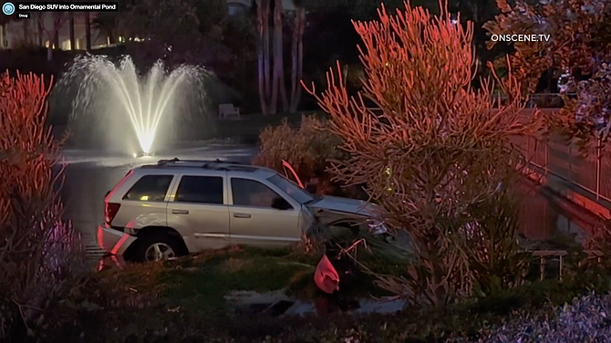 An SUV crashed into a pond inside the Vista Del Lago gated community in Rancho Bernardo.