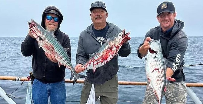 Happy anglers with some very big bonito for anglers aboard the Dolphin half-day run.