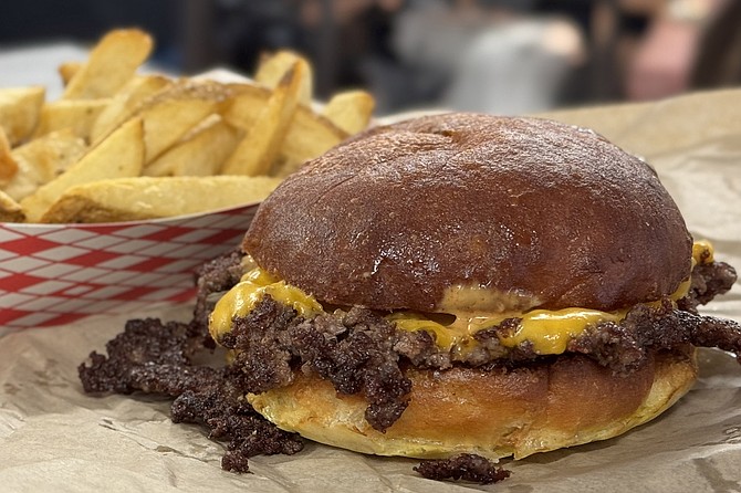 An OG smash burger with tallow fries