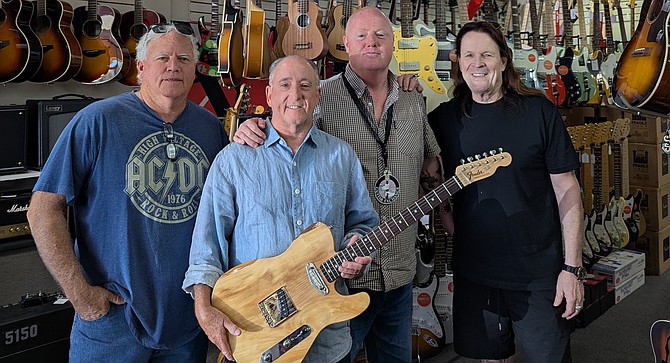 Tom Gorman, Jim Weaver and his Timbercaster, Tai Harbinson, and Jeff Lzzarini at Mark's Guitar in Chula Vista.
