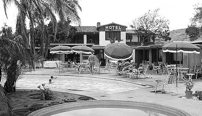 Joe McCarthy threw his wife, clothes and all, into the pool.