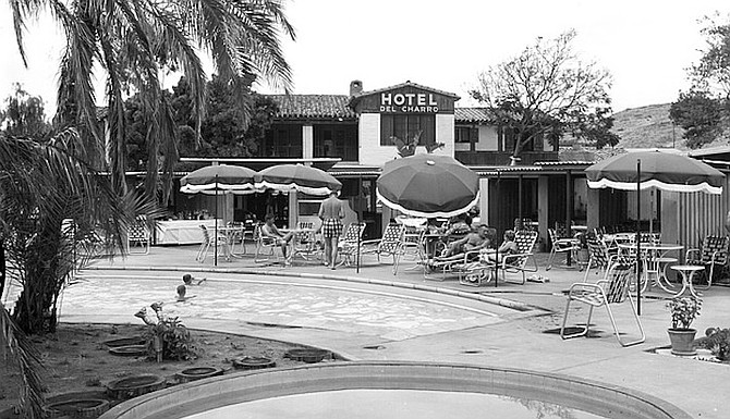 Joe McCarthy threw his wife, clothes and all, into the pool.