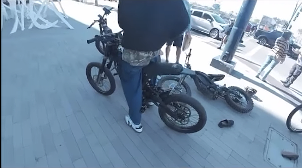 Kids on e-bikes run a stop, get ticket
