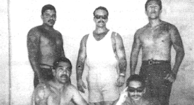 Sammy Santos, standing, left. One of the bullets pierced Santos’s heart and lung.