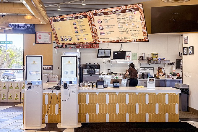Fewer fast food workers, replaced by digital kiosks (and one of them is out of order)