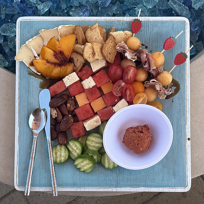 The "Picnic Plate" with peaches, melons, tomatoes, prosciutto, njuda, brie and aged cheddar