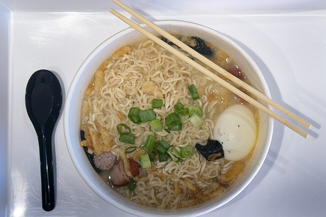 Add-on toppings include green onions, sliced sausage, and boiled egg