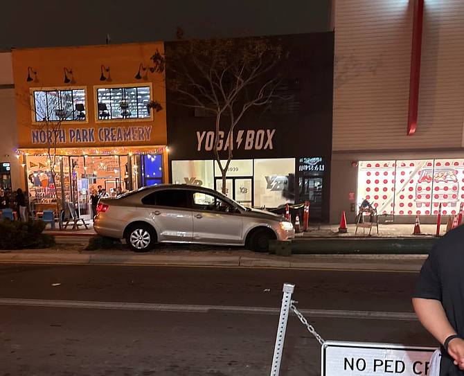 A driver crashed into a pole outside North Park Creamery — two doors down from Target — before running away on foot.