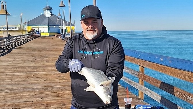 Angler Fabian Medina with a chunky spotfin croaker caught from Imperial Beach Pier.