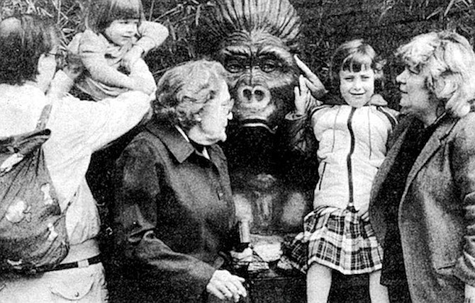 Family with gorilla statue. ‘‘Man is the animal who knows he must die.”