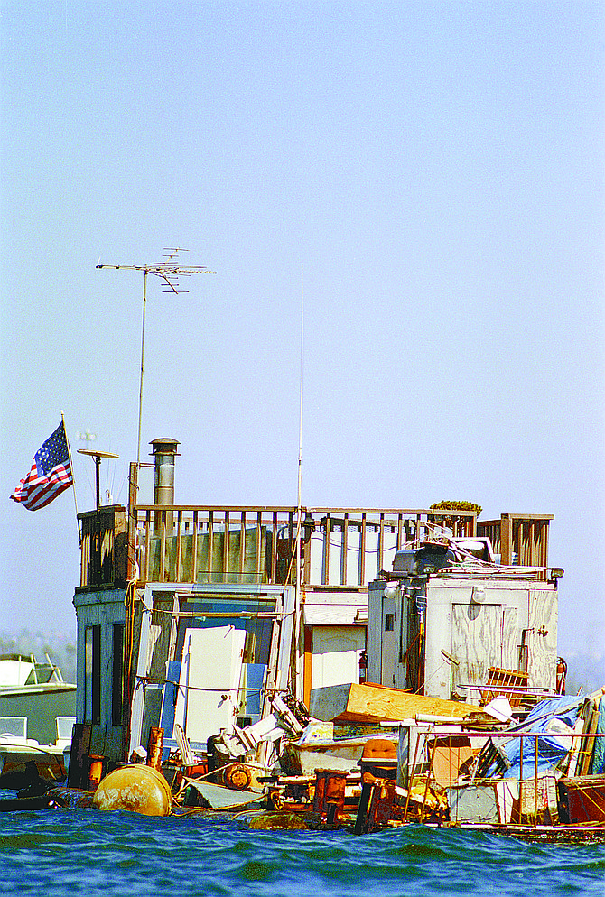 Many of the vessels are heaped with stuff, barrels, tarps, pieces of plastic, water buckets, nets, bits and pieces of other boats and usually, on top, a bicycle.