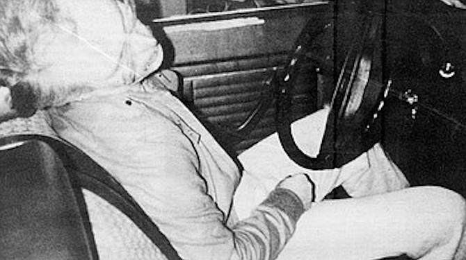 Coroner's photograph of Rodger Whitehead. Will reached through the open driver’s side window to shake him, and Rodger’s whole body moved. Rigor mortis.