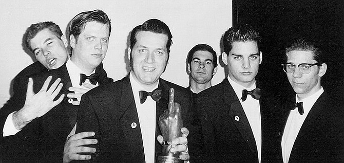 Rocket From the Crypt (John Reis, center; Pete Reichert, third from right), 1996. Originally Rocket swore it would play only backyard parties.