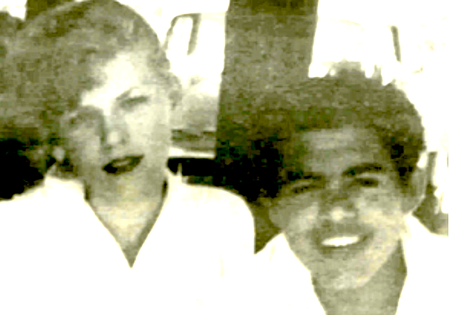 Sharon and Ramon, Edens Drive-in, 1955. From inside the drive-in I can see Ramon weaving down Main Street through the twilight eucalyptus.