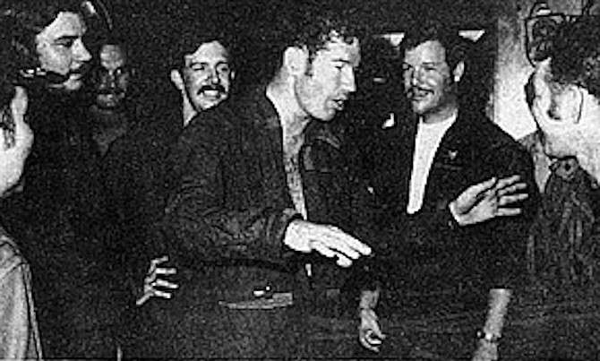 Cunningham (gesturing) and Driscoll (behind him) recounting the Col. Tomb battle, U.S.S. Constellation, May 10, 1972