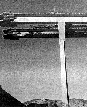 Prestressed cantilever construction: concrete is poured on both ends span atop a column (1974).