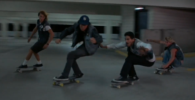Denim vests and button-down shirts — now that's Wild in the Streets. (Still from Thrashin'.)