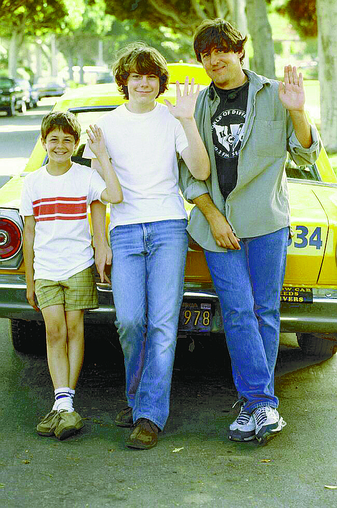 Michael Angarano, Patrick Fugit, and Cameron Crowe on the set of Almost Famous. The movie strikes me as insufferable dogmeat.