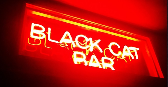 Sign for Black Cat Bar, which is once again hosting San Diego's edition of the International Pop Overthrow