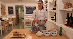 Vegan chef Katie Gluck of <a href="http://katieshealingkitchen.com">Katie's Healing Kitchen</a> creates a vegan dish from scratch at the Wine Vault and Bistro.