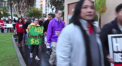 Fast food workers rally in San Diego to call for a higher minimum wage. 
