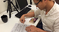 Tam translates the documents for his father's release from a reeducation camp in Vietnam. 